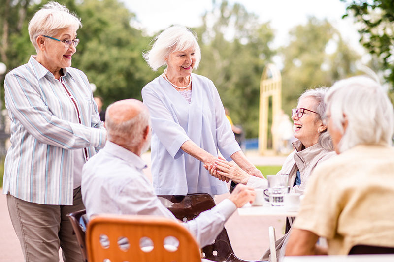 Group of seniors bonding at Riverside senior life community