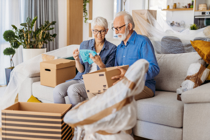 Senior couple packs to move